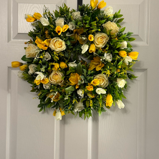 Lemon rose with yellow/white crocus, ivory rose buds and foliage wreath