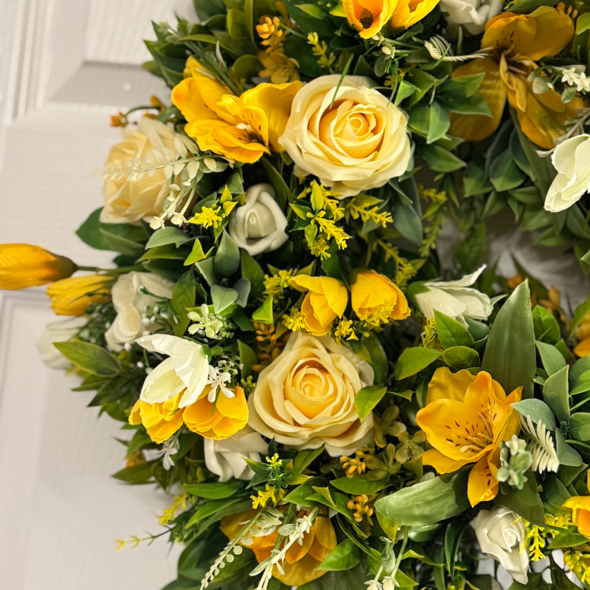 Lemon rose with yellow/white crocus, ivory rose buds and foliage wreath