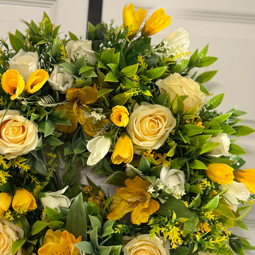 Lemon rose with yellow/white crocus, ivory rose buds and foliage wreath