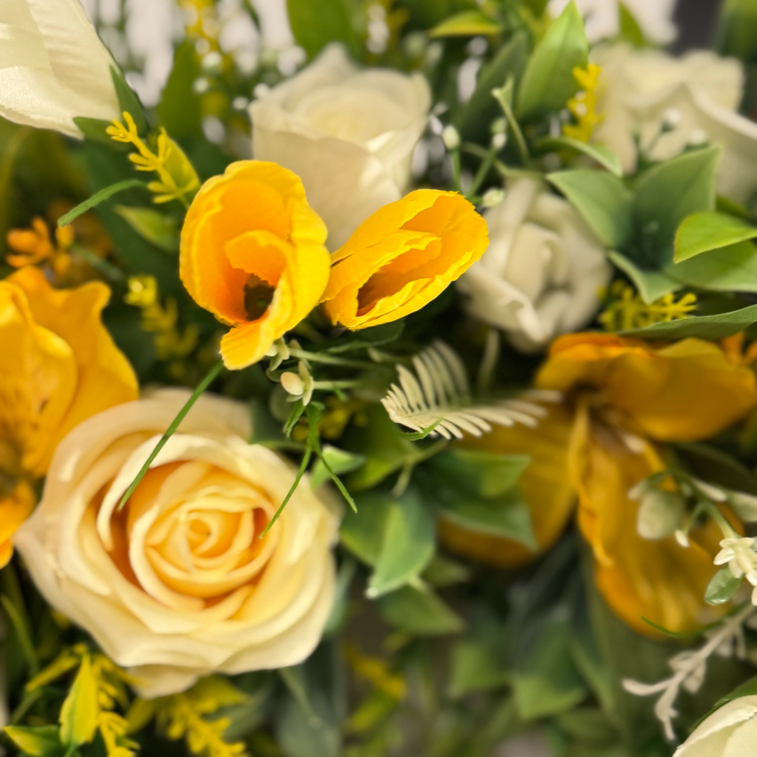 Lemon rose with yellow/white crocus, ivory rose buds and foliage wreath