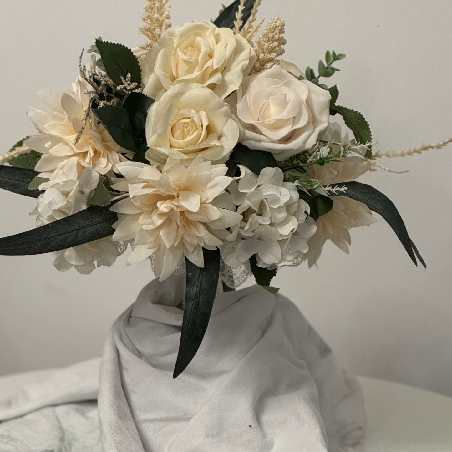 Artificial wedding ivory bridal bouquet with green leaves