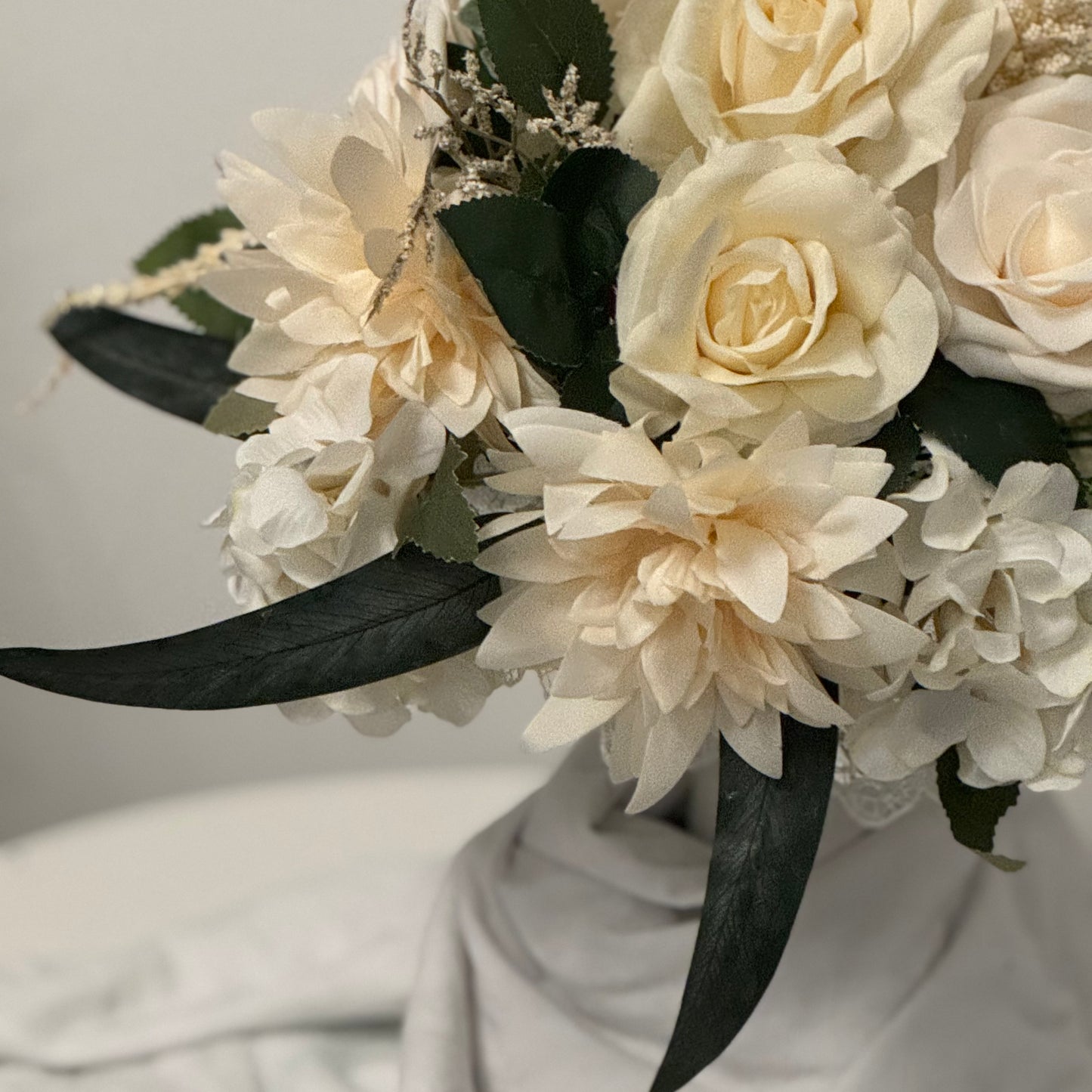 Artificial wedding ivory bridal bouquet with green leaves