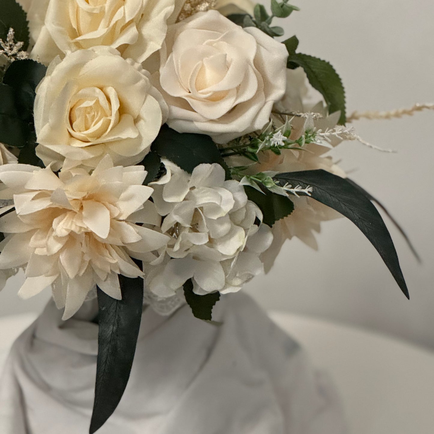 Artificial wedding ivory bridal bouquet with green leaves