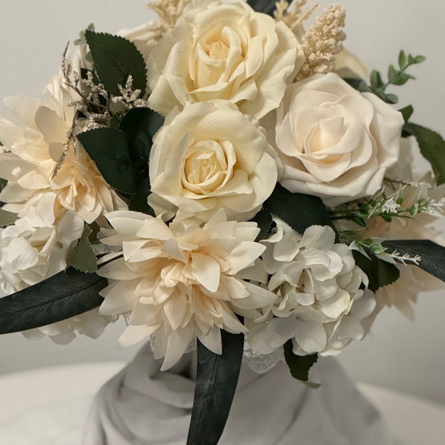 Artificial wedding ivory bridal bouquet with green leaves