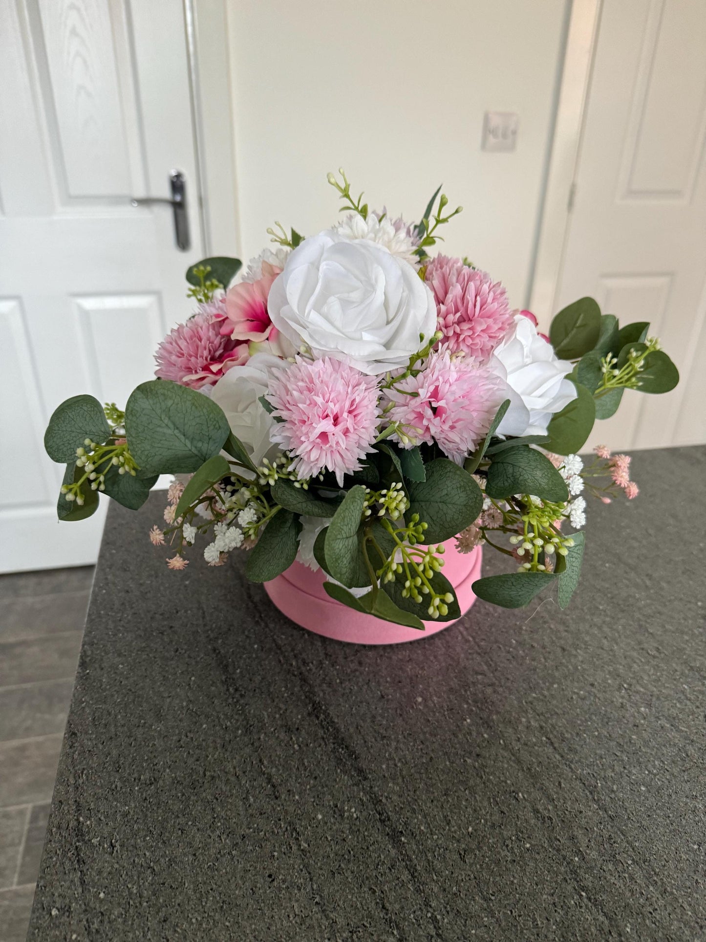 Stunning luxury pink suede hat box with artificial pink and white flowers and leaves