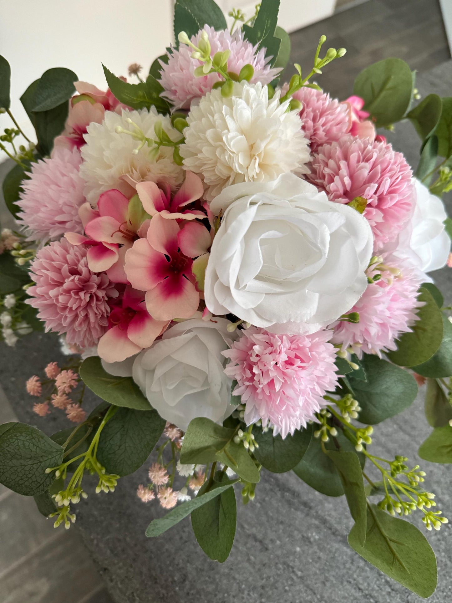 Stunning luxury pink suede hat box with artificial pink and white flowers and leaves