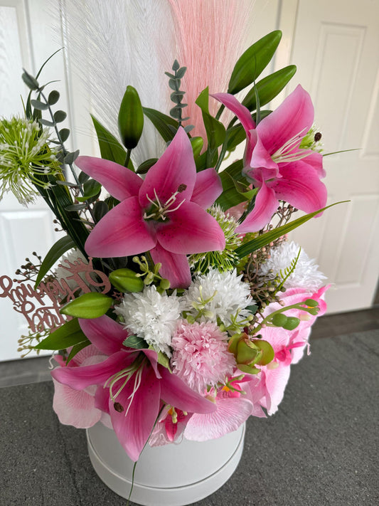 Luxury white hat box with artificial pink lilys