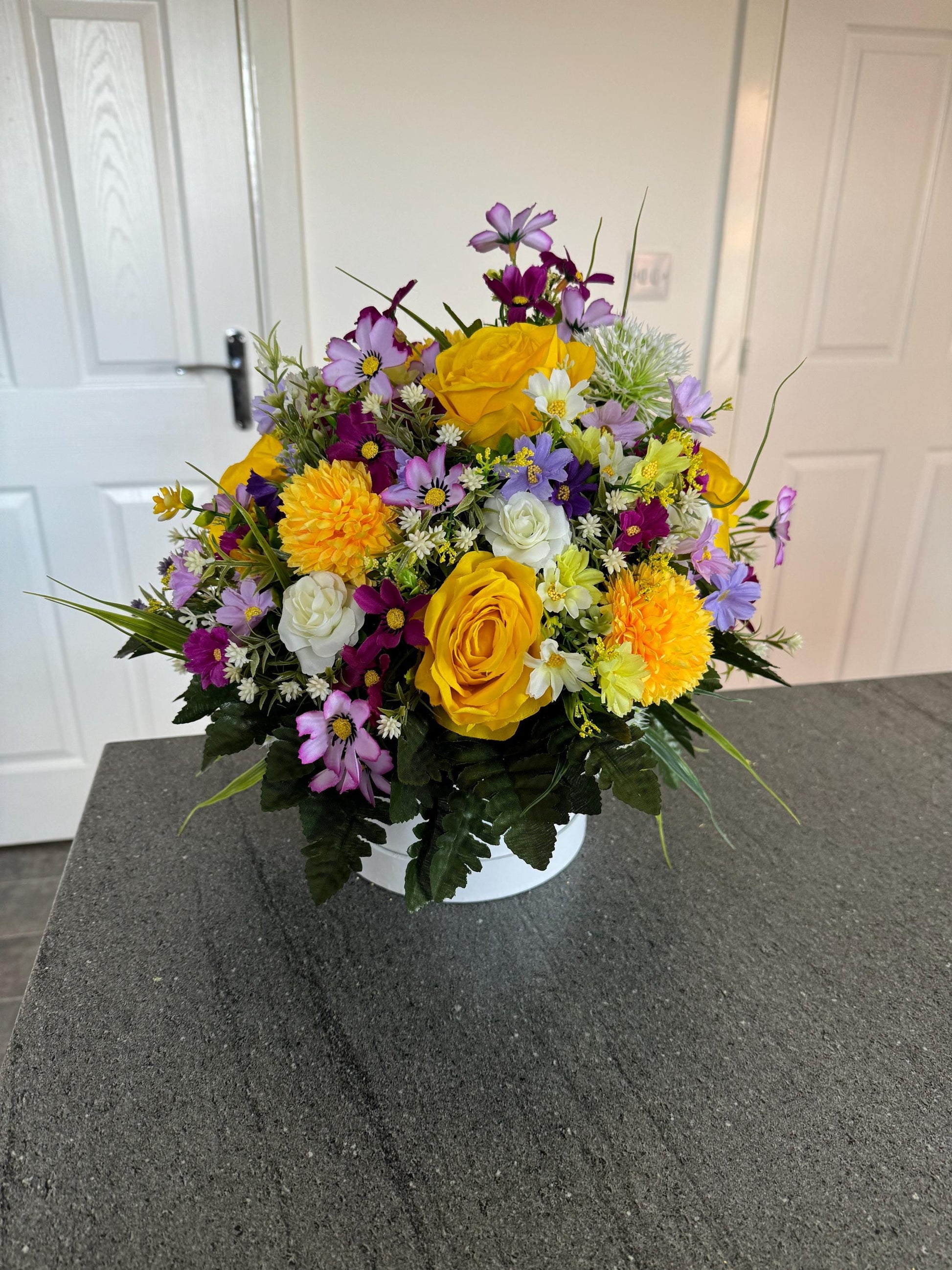 Unique, handmade floral White Lilly hatbox arrangement filled with artificial greenery, flowers and yellow roses.