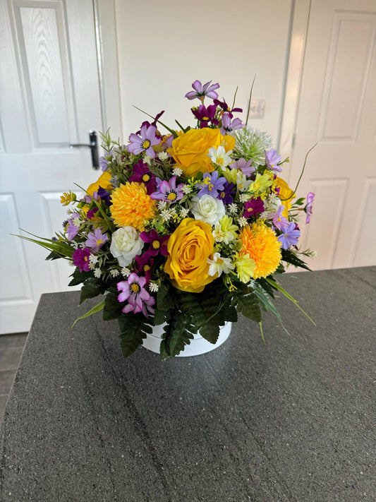 Unique, handmade floral White Lilly hatbox arrangement filled with artificial greenery, flowers and yellow roses.