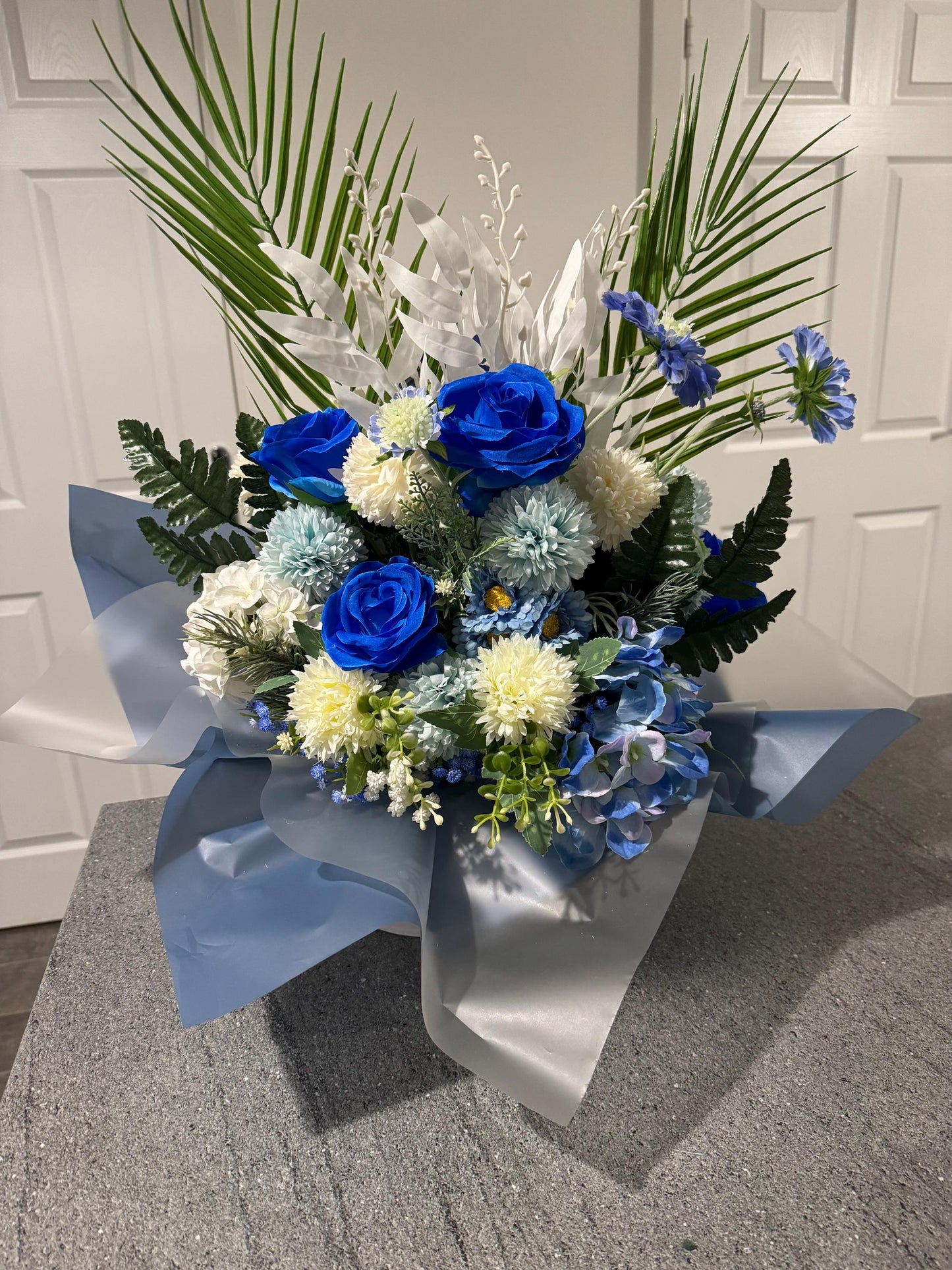 Luxury white hat box with white and blue artificial flowers