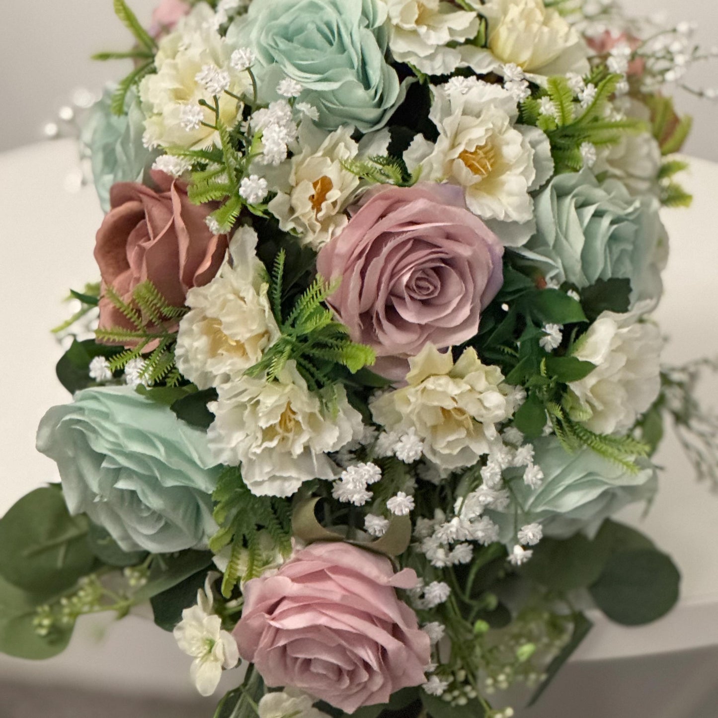 Artificial wedding bridal Teardrop bouquet with blush pink roses, sage green roses and ivory carnations with foliage