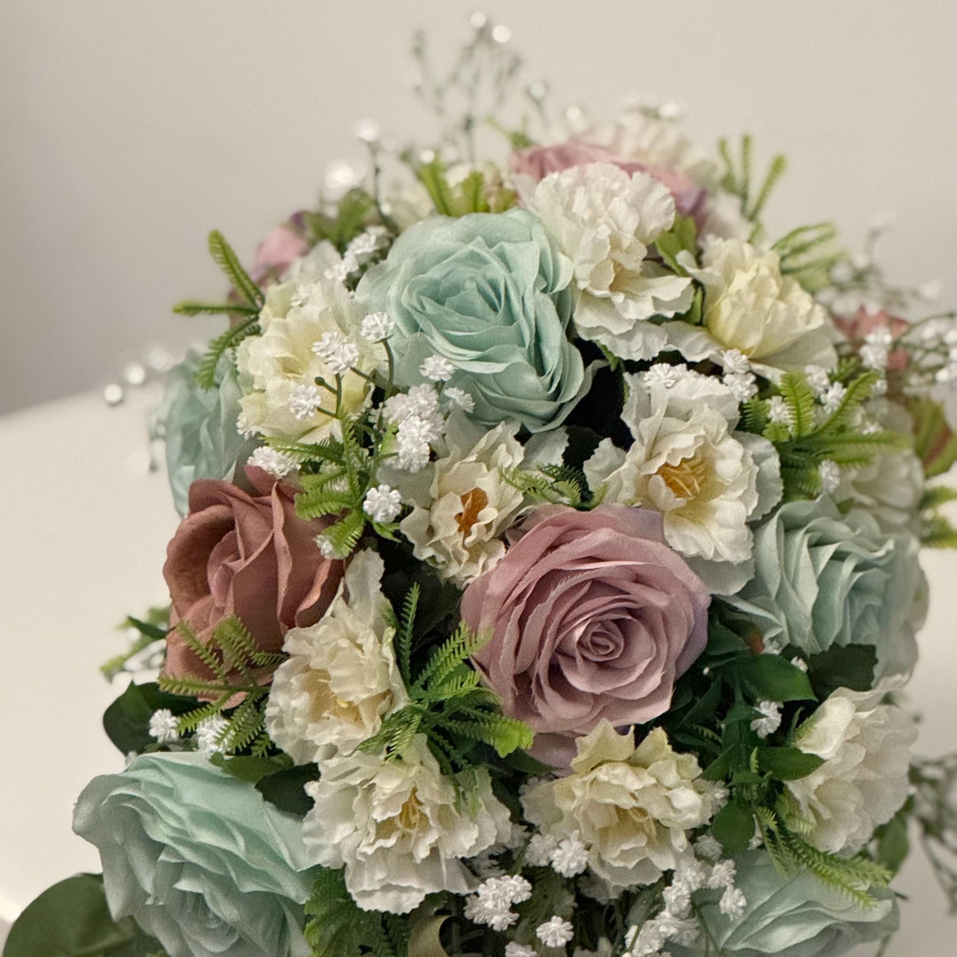 Artificial wedding bridal Teardrop bouquet with blush pink roses, sage green roses and ivory carnations with foliage