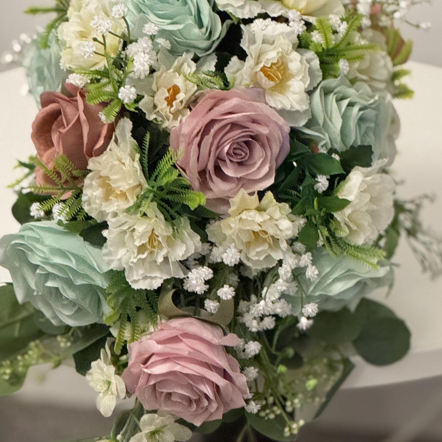 Artificial wedding bridal Teardrop bouquet with blush pink roses, sage green roses and ivory carnations with foliage