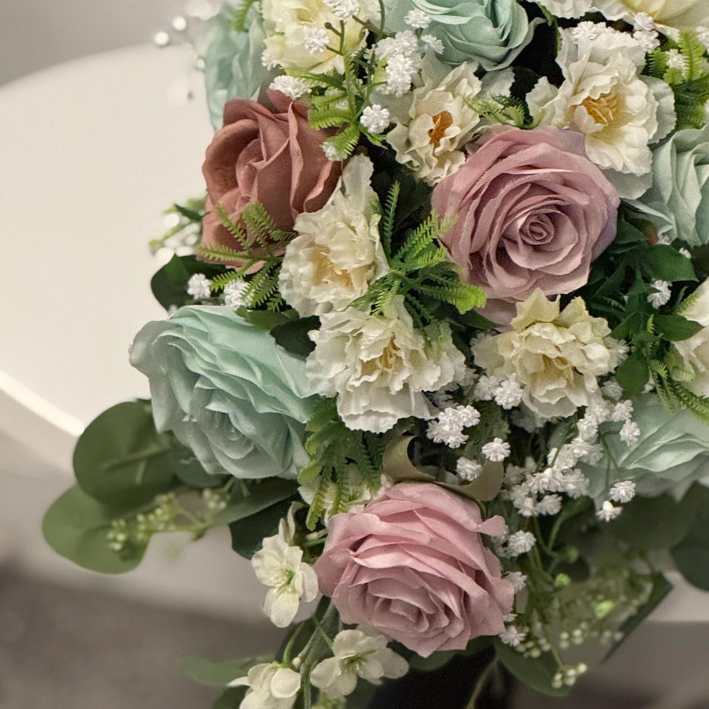 Artificial wedding bridal Teardrop bouquet with blush pink roses, sage green roses and ivory carnations with foliage