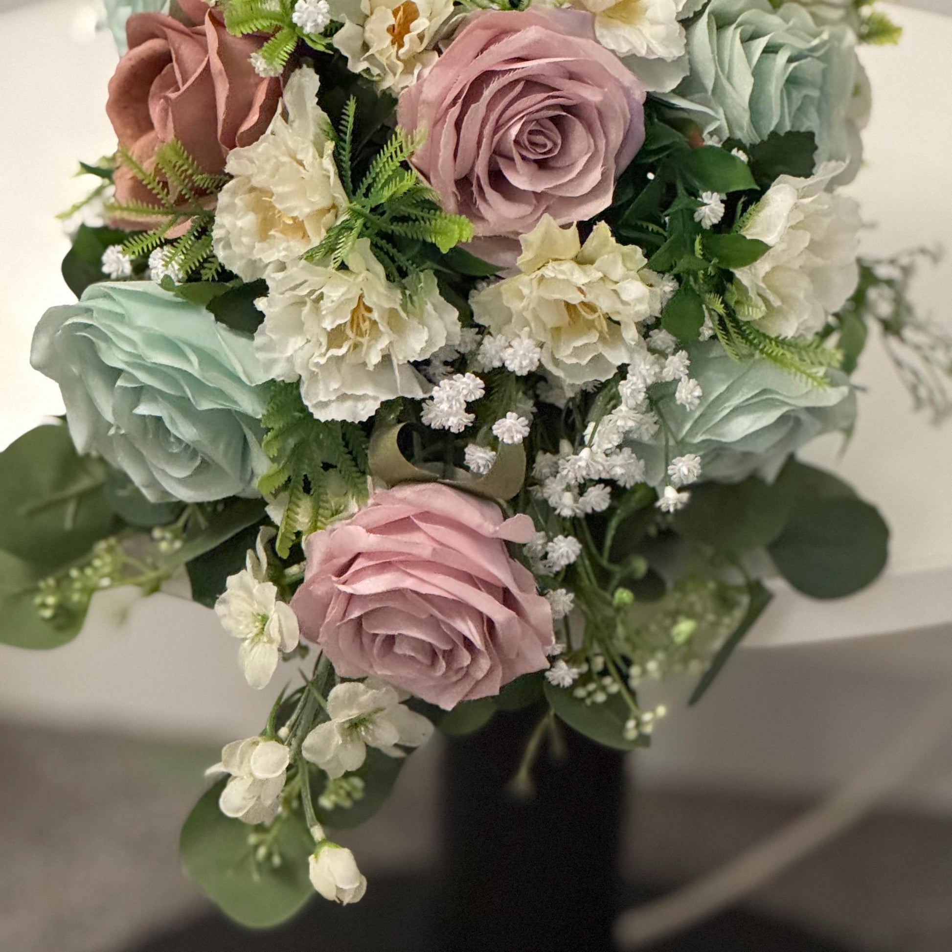 Artificial wedding bridal Teardrop bouquet with blush pink roses, sage green roses and ivory carnations with foliage