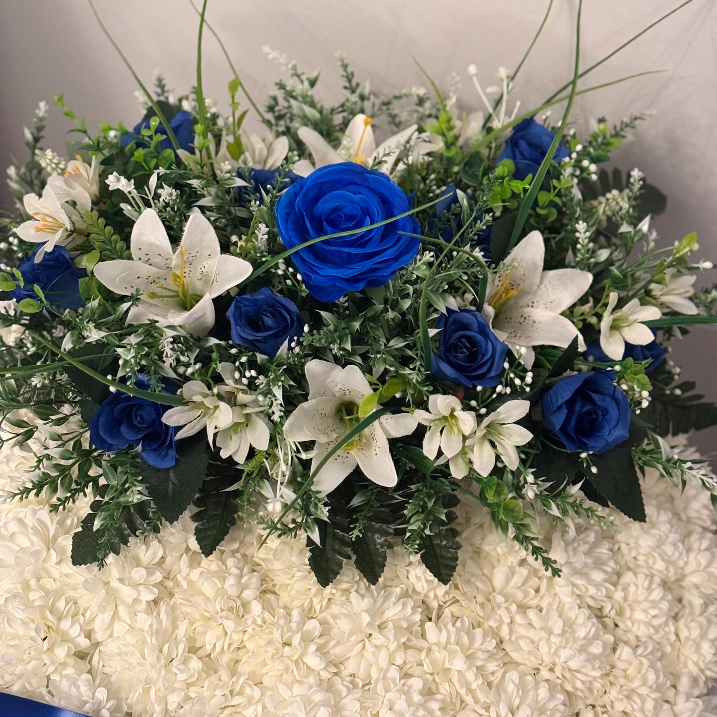 Posey 18 “ Shaped Silk Artificial Funeral Flowers Wreath/Memorial/Grave Tributes with blue roses, white lily’s and green foliage