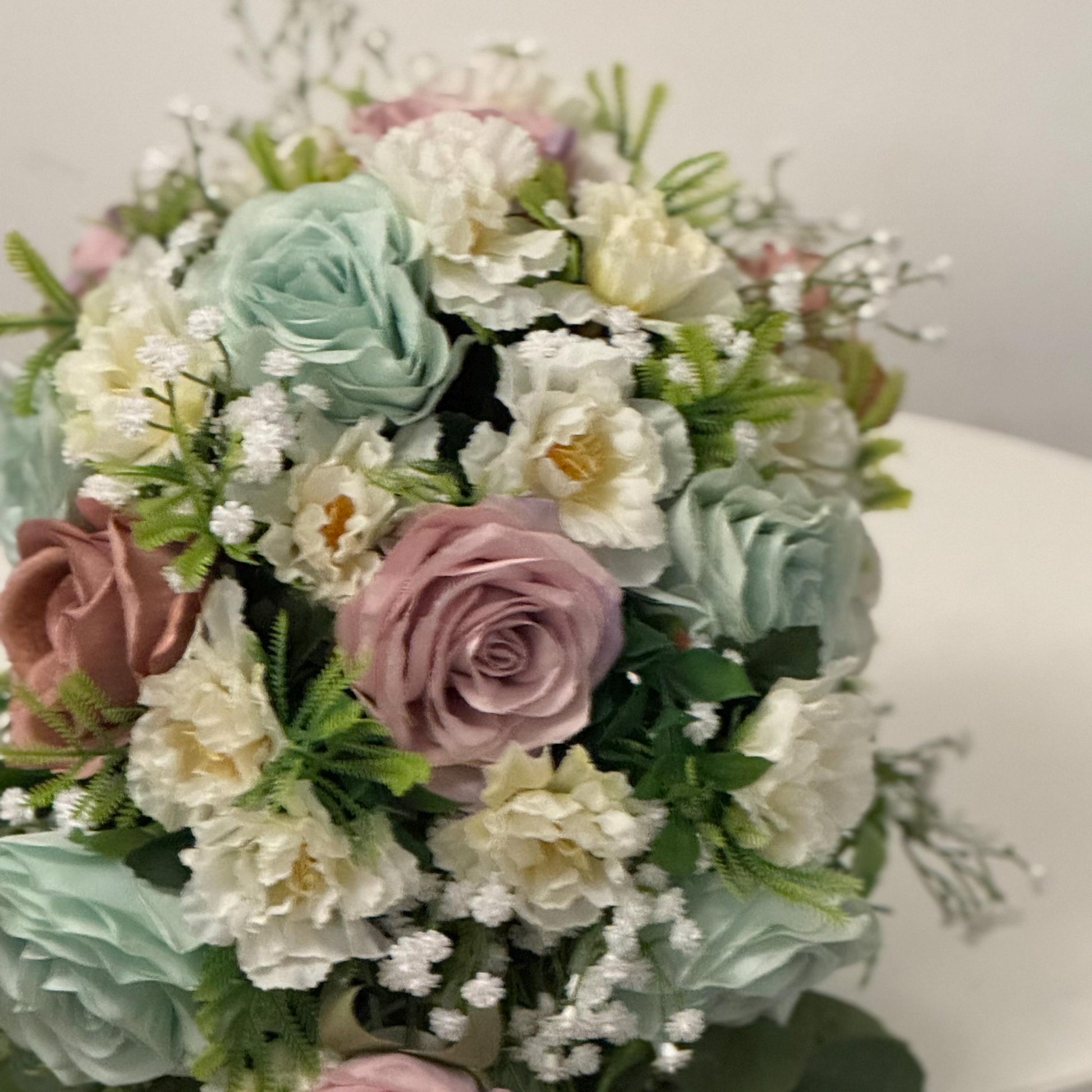 Artificial wedding bridal Teardrop bouquet with blush pink roses, sage green roses and ivory carnations with foliage