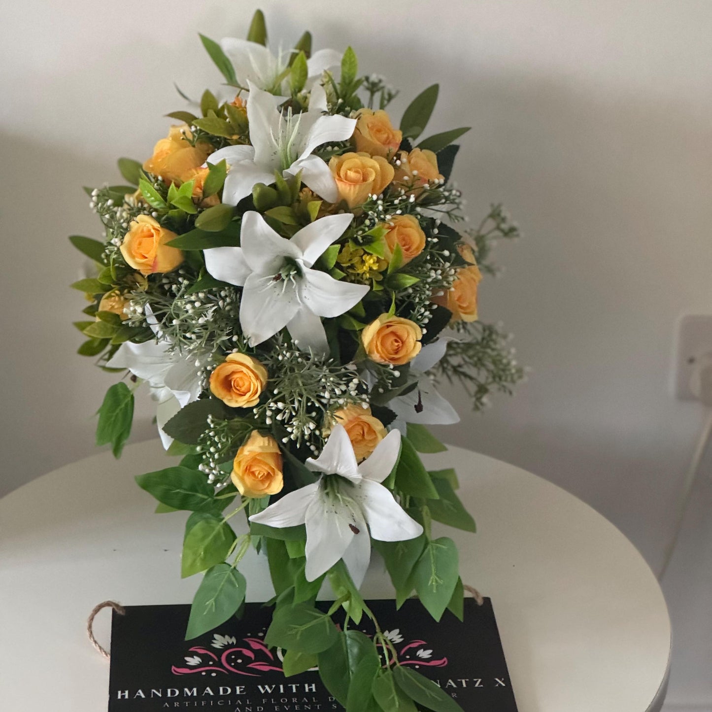 Artificial wedding bridal teardrop bouquet with white Lilys, yellow rosebuds and foliage. Ideal for spring/summer weddings