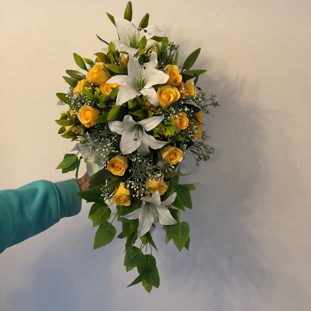 Artificial wedding bridal teardrop bouquet with white Lilys, yellow rosebuds and foliage. Ideal for spring/summer weddings