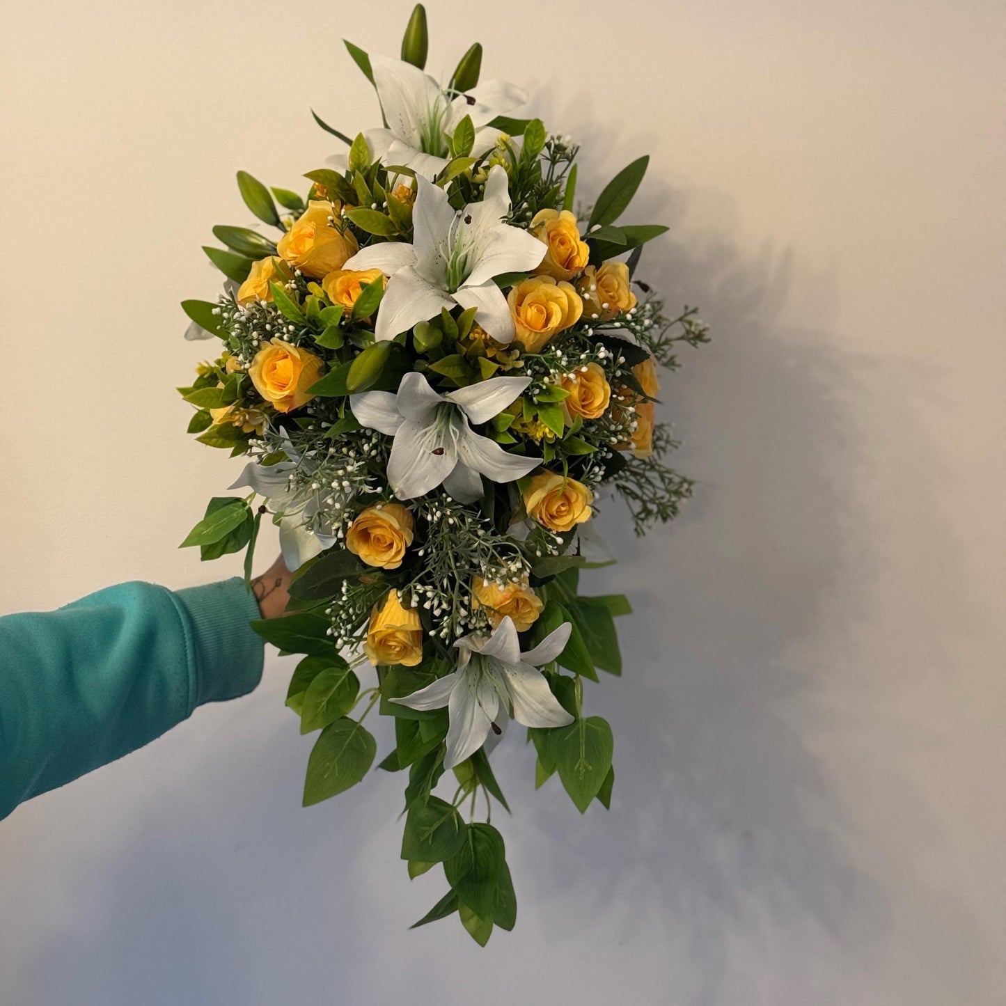 Artificial wedding bridal teardrop bouquet with white Lilys, yellow rosebuds and foliage. Ideal for spring/summer weddings