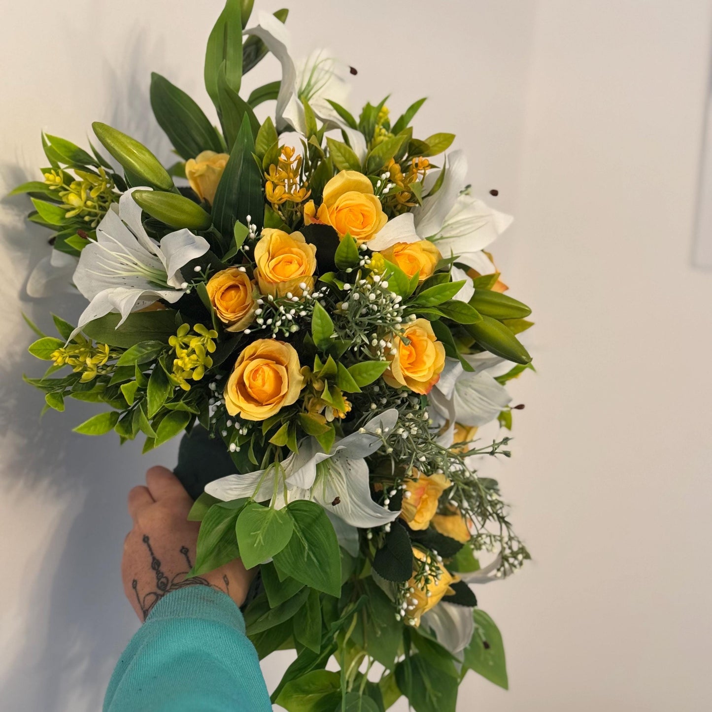 Artificial wedding bridal teardrop bouquet with white Lilys, yellow rosebuds and foliage. Ideal for spring/summer weddings