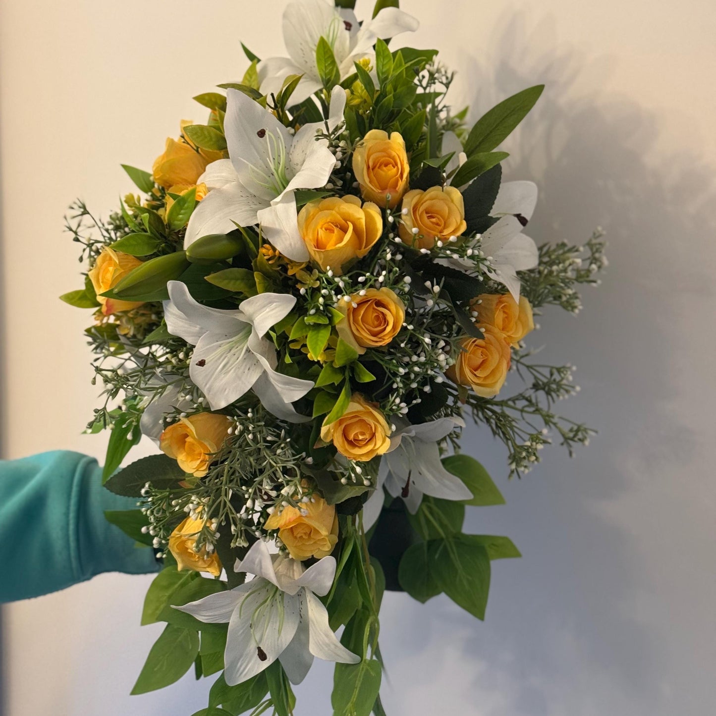 Artificial wedding bridal teardrop bouquet with white Lilys, yellow rosebuds and foliage. Ideal for spring/summer weddings