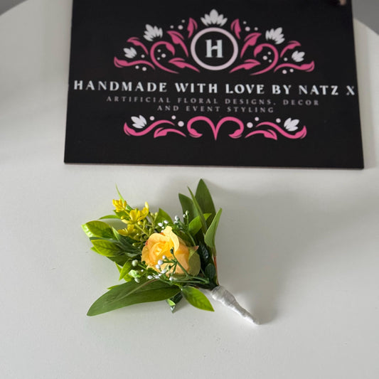 Artificial wedding single yellow rosebud with foliage buttonholes. Ideal for spring/summer weddings