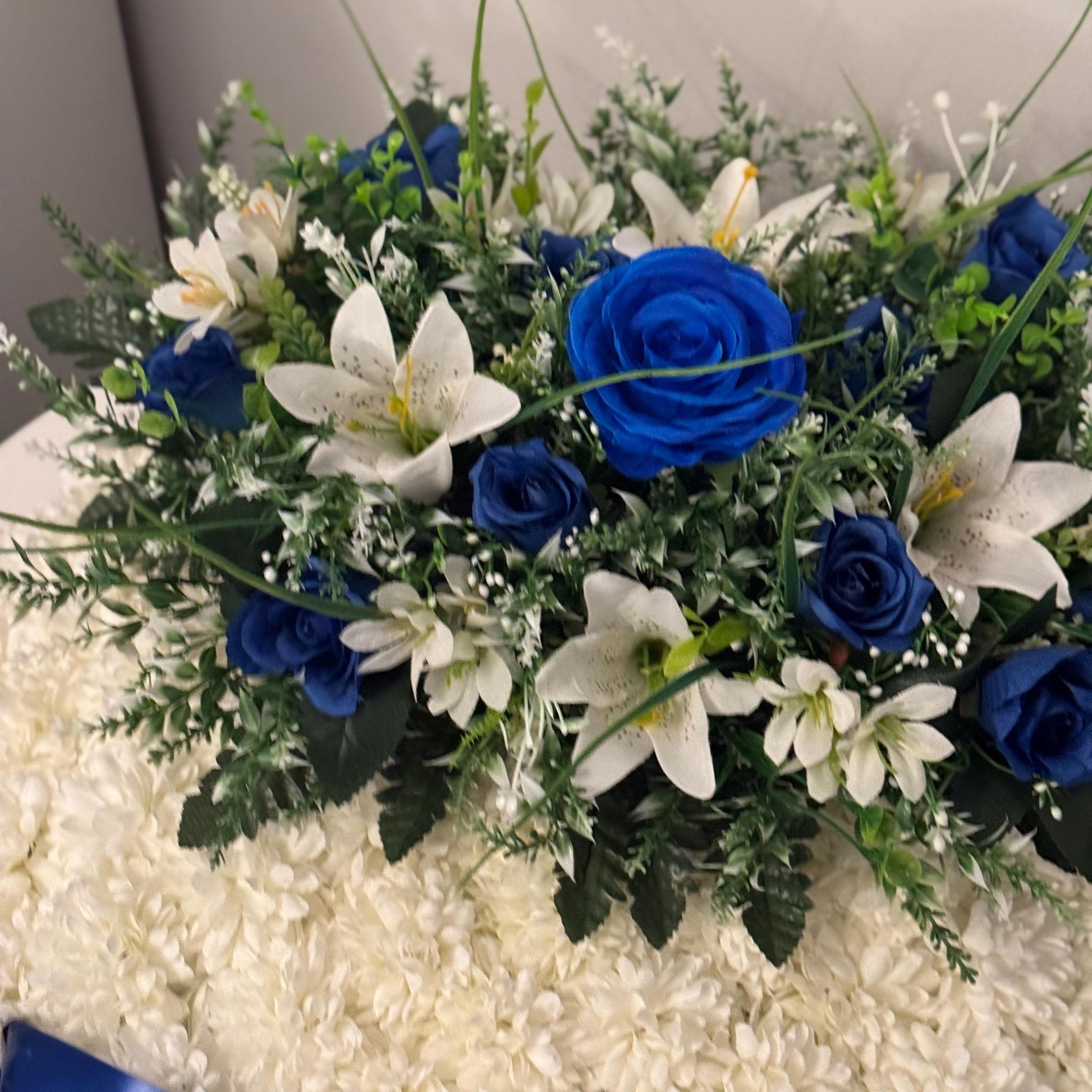 Posey 18 “ Shaped Silk Artificial Funeral Flowers Wreath/Memorial/Grave Tributes with blue roses, white lily’s and green foliage